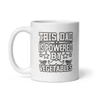 White mug with 'Powered by Vegetables' text.