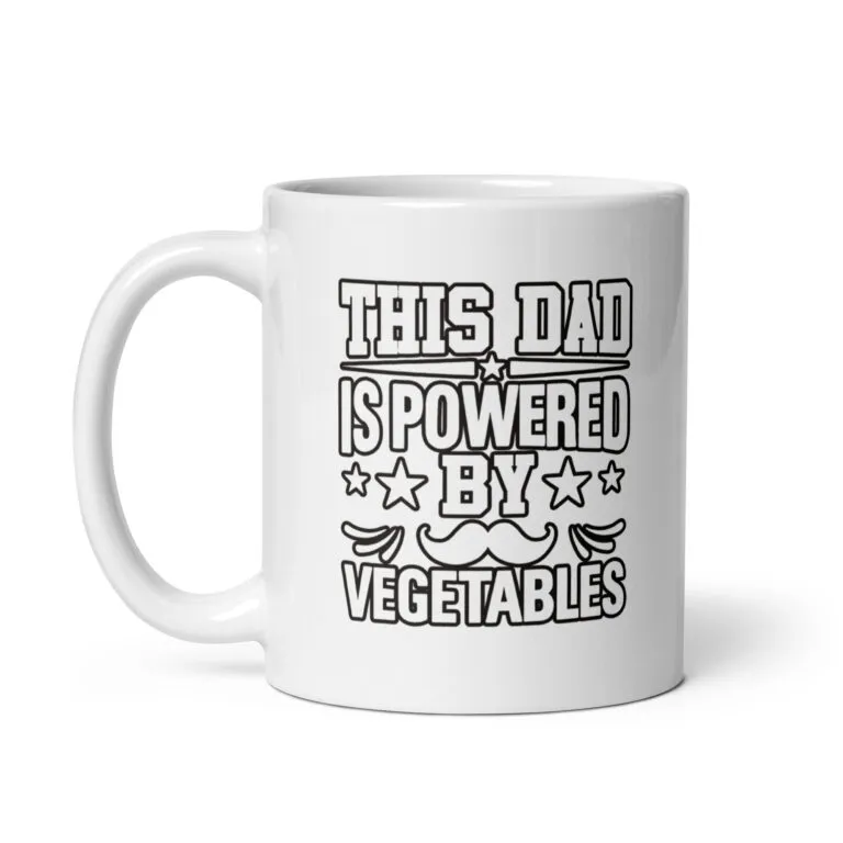 White mug with 'Powered by Vegetables' text.