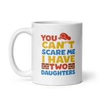 White mug with humorous text about daughters.