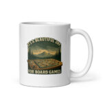 Mug with board game graphics and mountains.