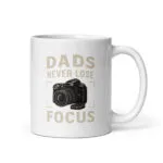 White mug with camera design and dad quote.