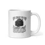 Photographer-themed mug with humorous camera graphic.