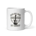 White mug with guitar dad rock star design.