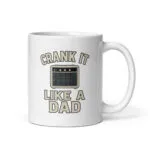 White mug with 'Crank It Like A Dad' design.