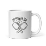 Pickleball mug with paddles and ball design.