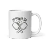 Pickleball mug with paddles and ball design.