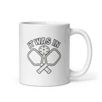 Pickleball mug with paddles and ball design.