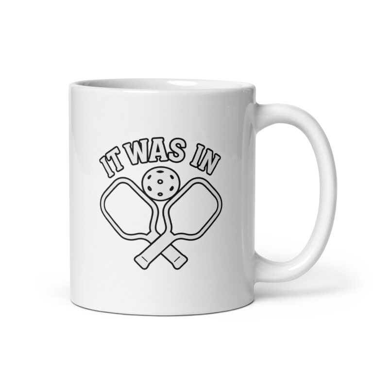 Pickleball mug with paddles and ball design.