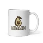 White mug with avocado illustration and 'DADACADO' text.
