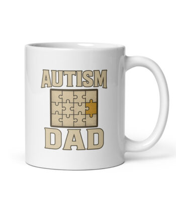 White mug with 'Autism Dad' puzzle design.
