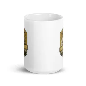 White mug with golden badge design