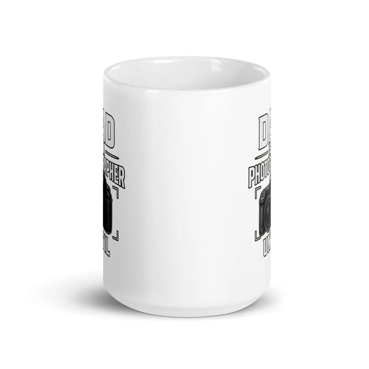 White mug with camera design and text.