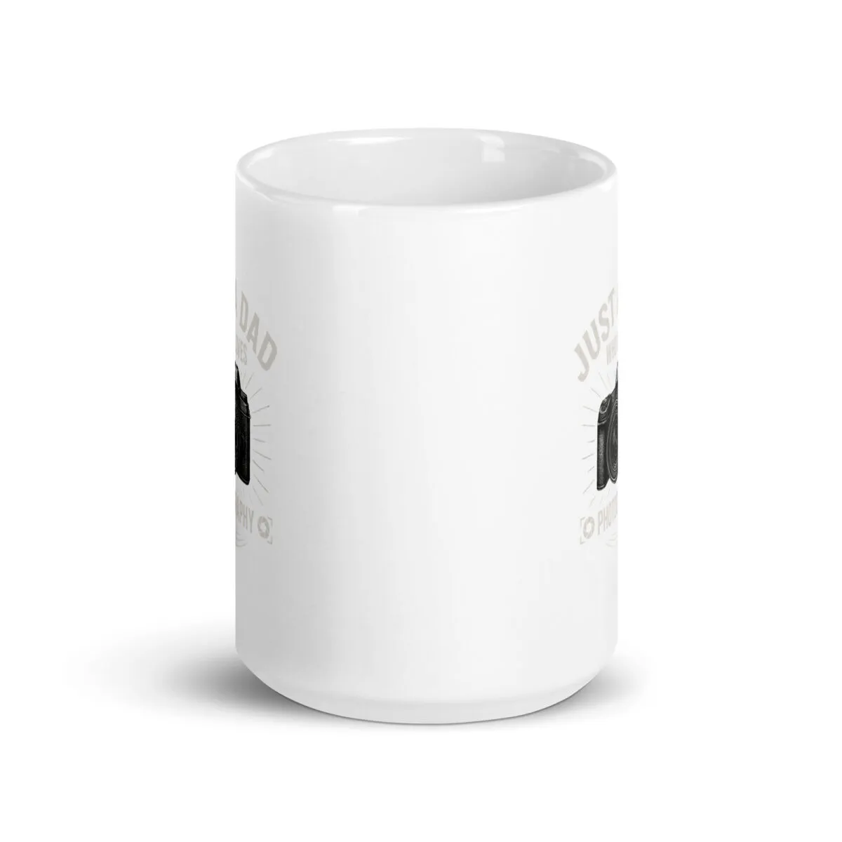 White mug with camera design and text