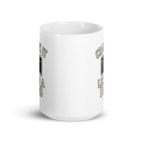 White mug with amp design and text