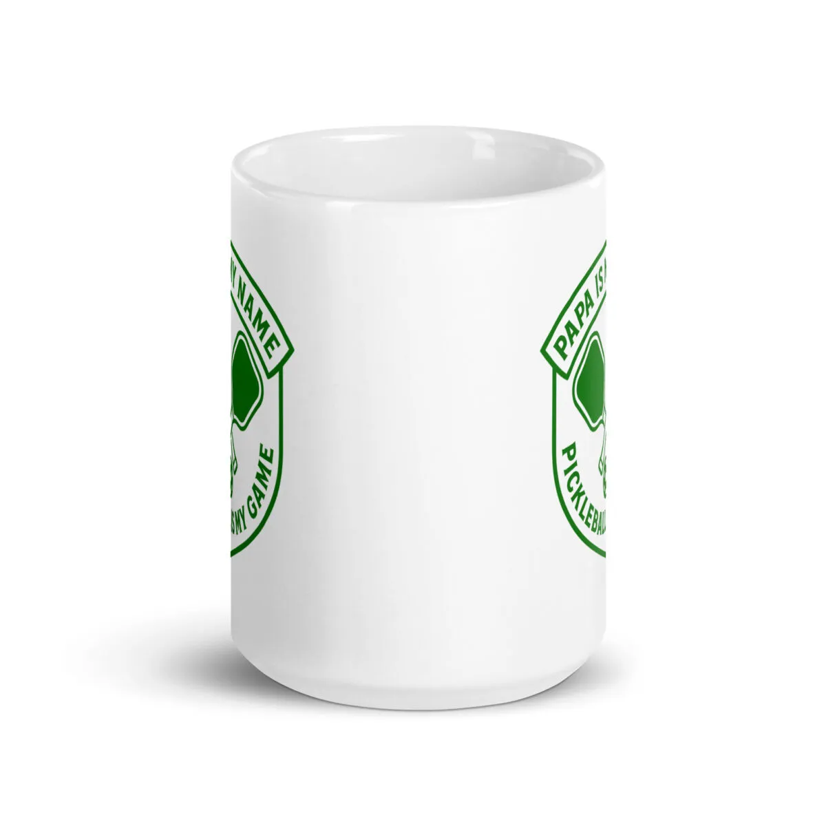 White mug with pickleball-themed design.