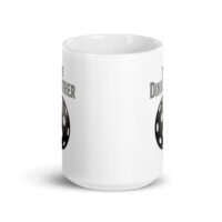 White mug with dinosaur egg illustration