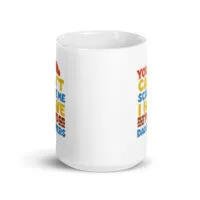 White mug with colorful text design.