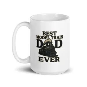 White mug with 'Best Model Train Dad' design.
