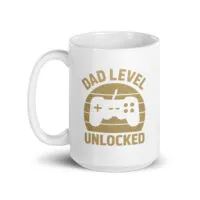 White mug with 'Dad Level Unlocked' design.
