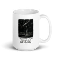 White mug with astronaut design, space theme quote.