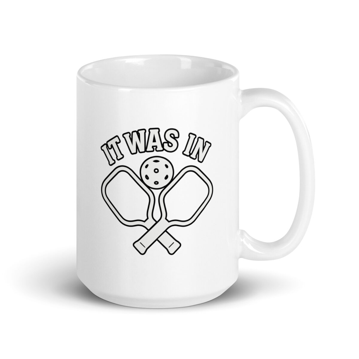 Pickleball mug with paddles and ball design.