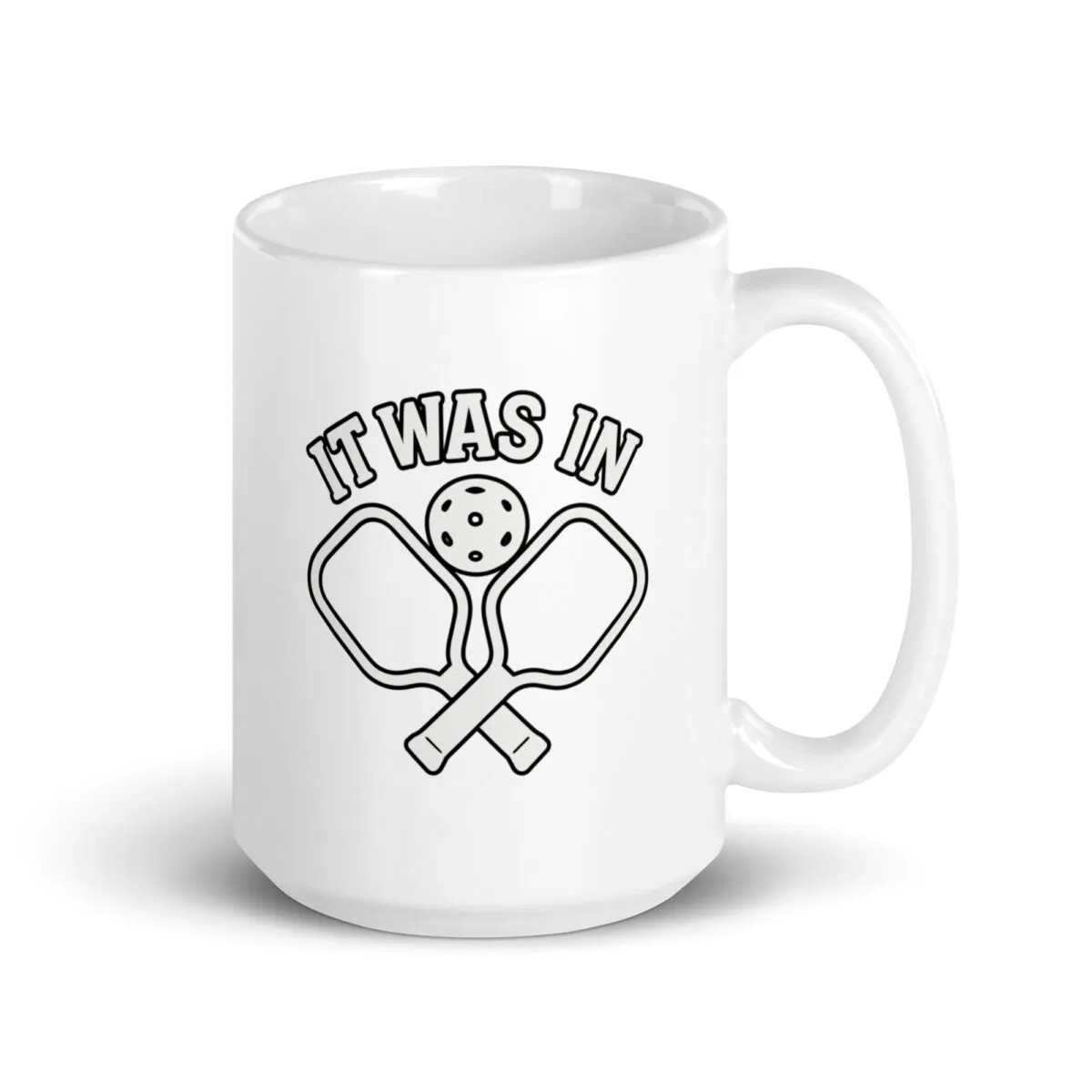 Pickleball mug with paddles and ball design.