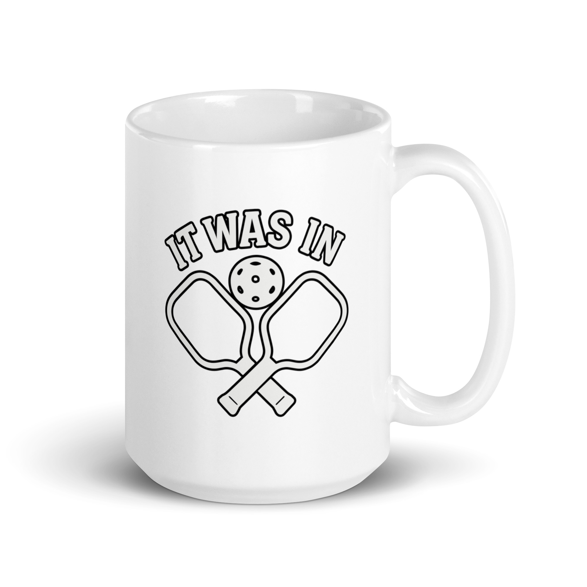 white-glossy-mug-white-15-oz-handle-on-right-68f6224c2f507.jpg Pickleball mug with paddles and ball design.