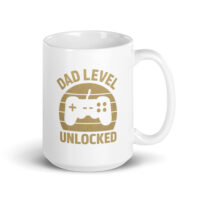 White mug with 'Dad Level Unlocked' design.