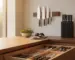 In-drawer knife organizer, wall-mounted magnetic knife strip, and countertop knife block in a modern kitchen