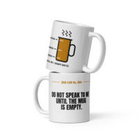 Stacked white Dad Law coffee mugs with humorous text