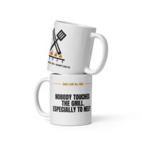 Stacked white mugs with humorous Dad Law grilling design