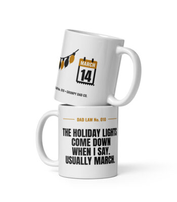 Stacked white mugs with humorous dad holiday-light designs