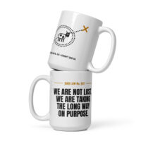 Two white Dad Law mugs with humorous printed designs