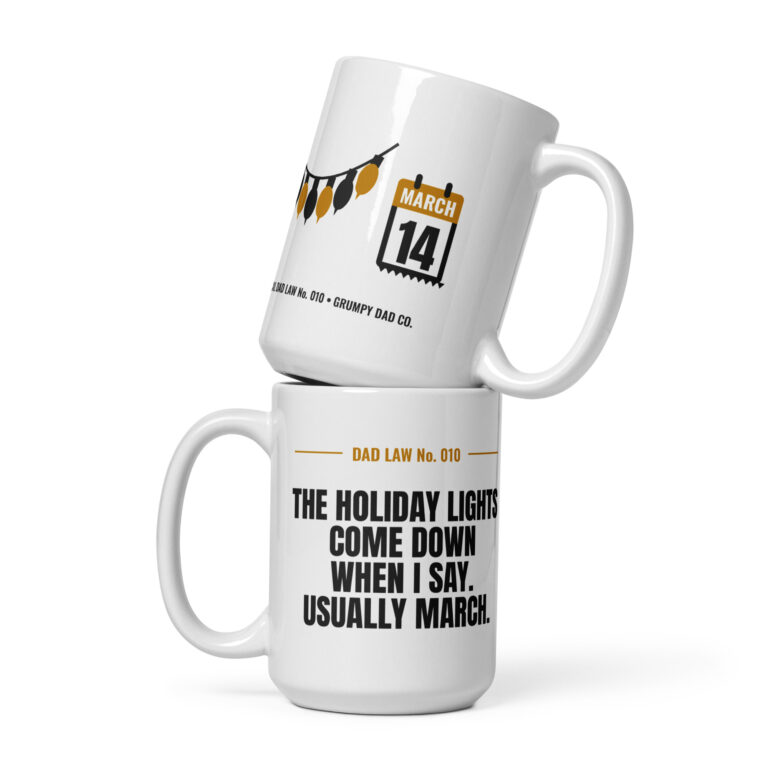 Two white Dad Law mugs stacked with humorous prints